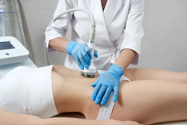 Lost the Weight but Not the Loose Skin? 2 woman having HIFU treatment on her stomach to combat loose skin Staveley following weight loss